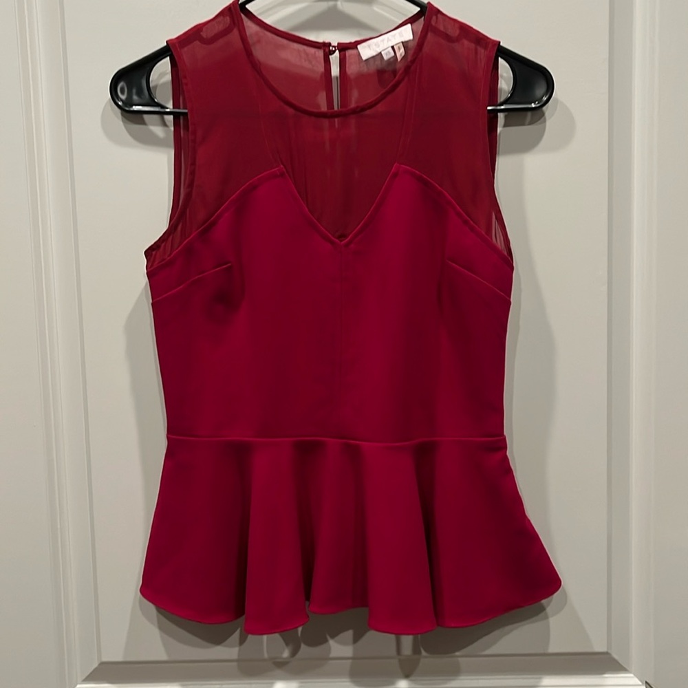 Magenta top with cut outs, sheer and ruffled hem